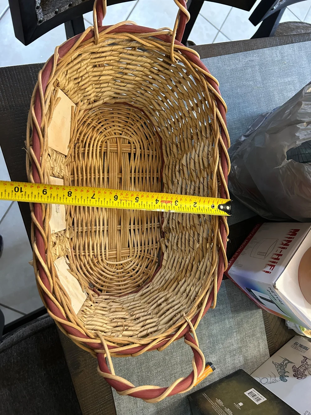 vintage woven wicker basket features hand-painted ceramic fruit tiles.